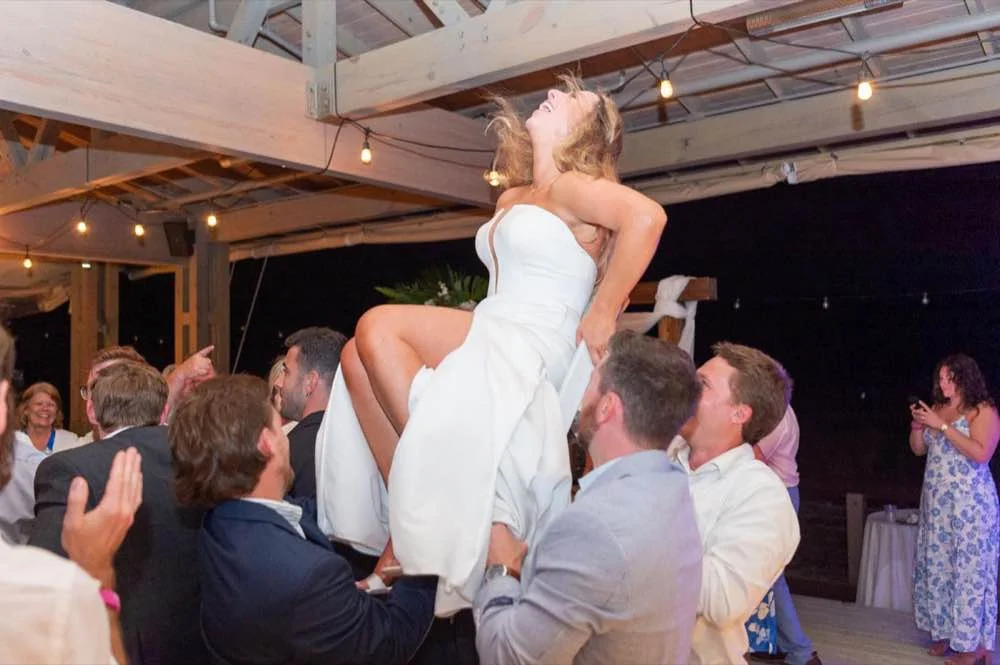 Best man checking groom's tie in Charleston, SC