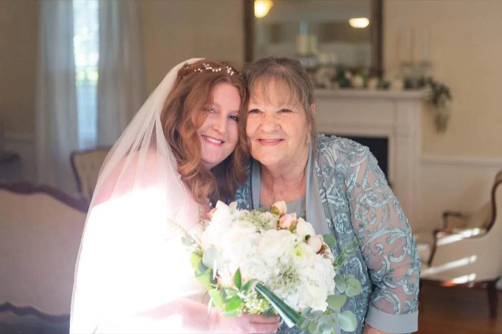 Candid portrait of the bride and mother of the groom