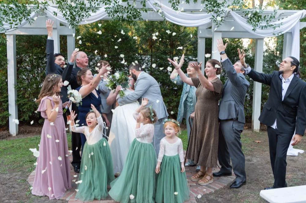 Outdoor wedding ceremony petal toss