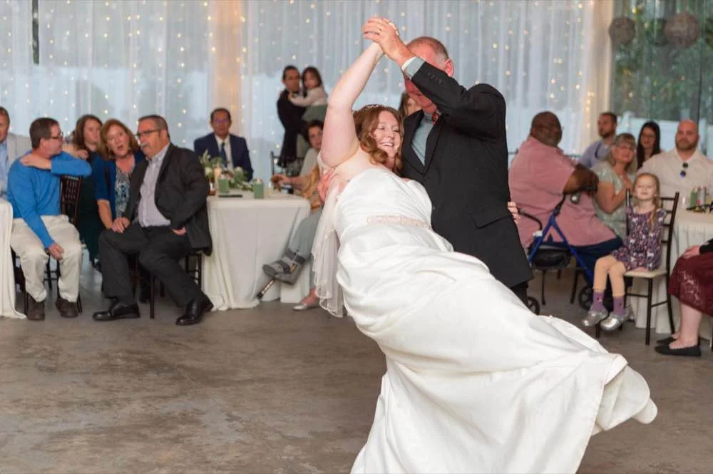 Bride being dipped during first dance