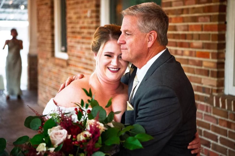 Emotional father daughter embrace
